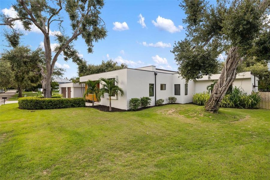 Front exterior of a new home in , Sarasota, FL, highlighting curb appeal (Image 30).