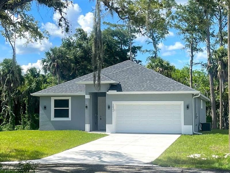 Front exterior of a new home in , Debary, FL, highlighting curb appeal (Image 1). Front exterior of a new home in , Debary, FL, highlighting curb appeal (Image 1).