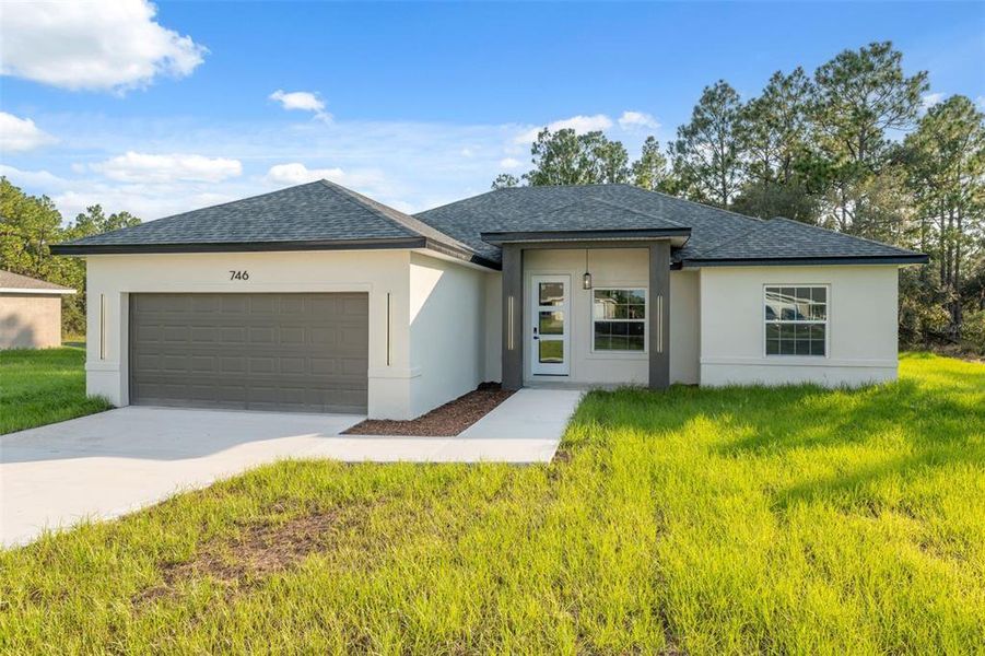 Front exterior of a new home in , Ocala, FL, highlighting curb appeal (Image 20).