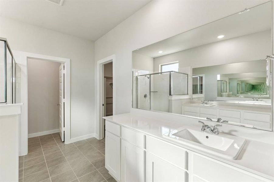 Primary Bathroom in the Wimbledon home plan by Trophy Signature Homes – REPRESENTATIVE PHOTO