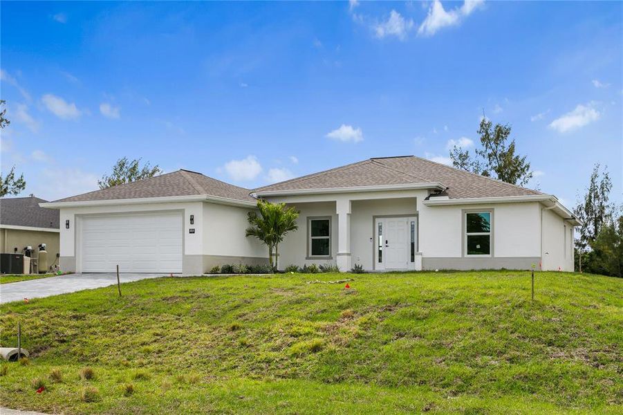 Front exterior of a new home in , Cape Coral, FL, highlighting curb appeal (Image 23).