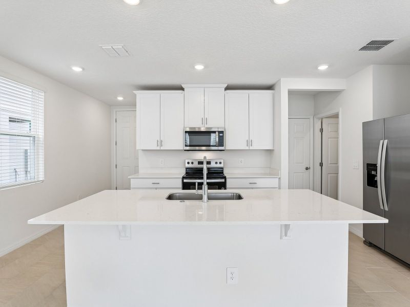 Furnished interior view inside a new home in The Meadow at Crossprairie Townes, St. Cloud (Image 4).
