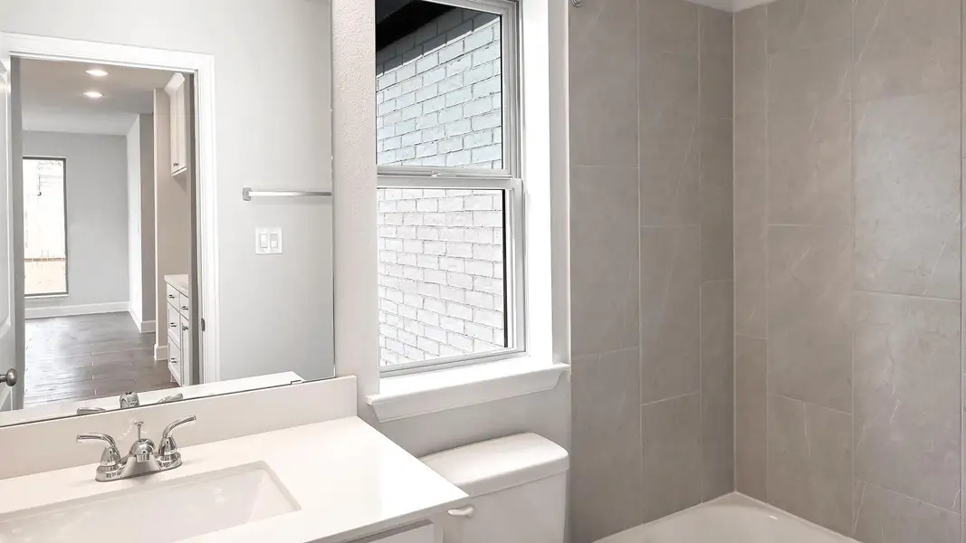 Bathroom featuring vanity and tub / shower combination