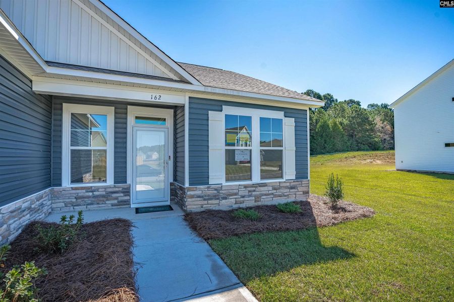 Exterior details and patio area of a home in Rolling Hills, Prosperity (Image 3).