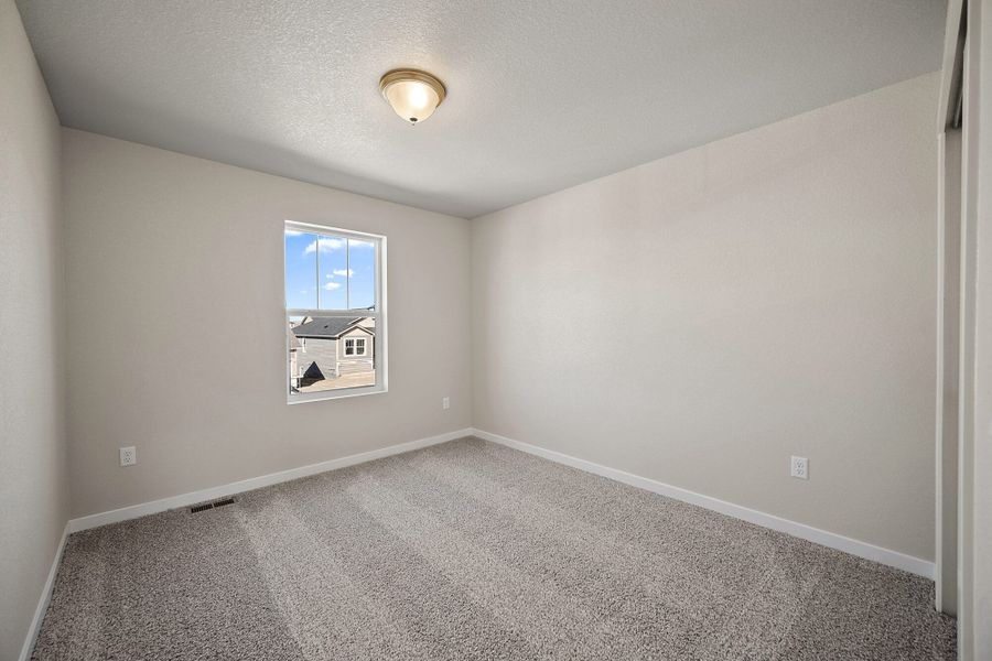 Spacious, unfurnished interior of a new home in Ridge at Lorson Ranch, Colorado Springs (Image 13).