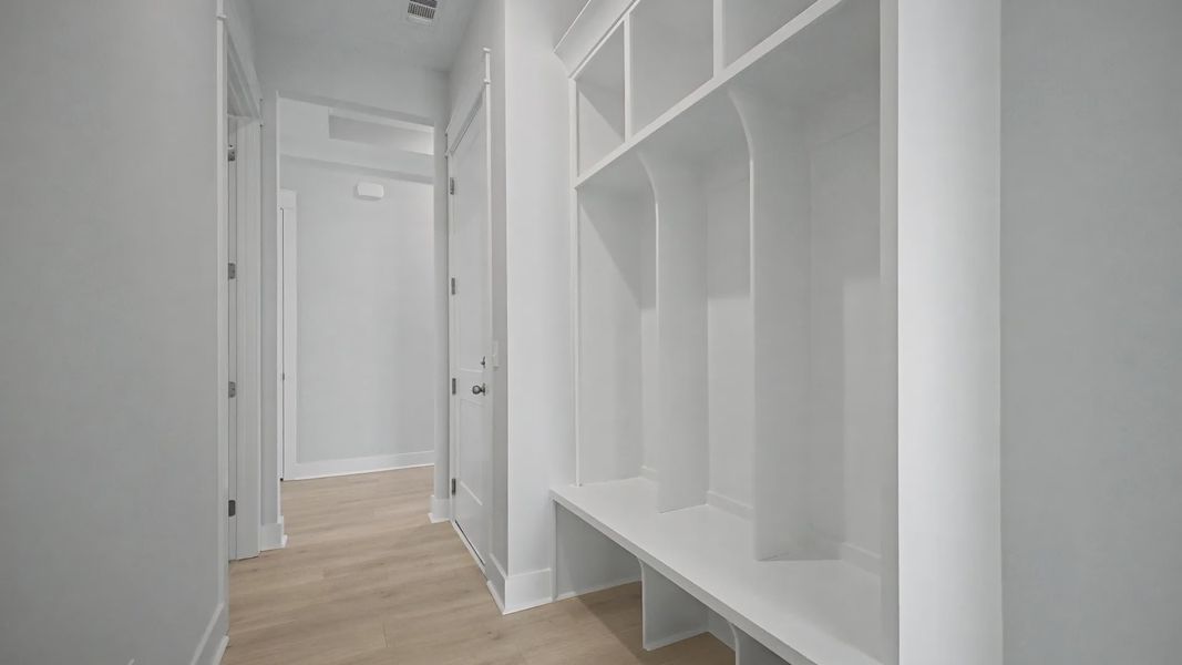 Craftsman built-in shelving and bench near garage entry Craftsman built-in shelving and bench near garage entry