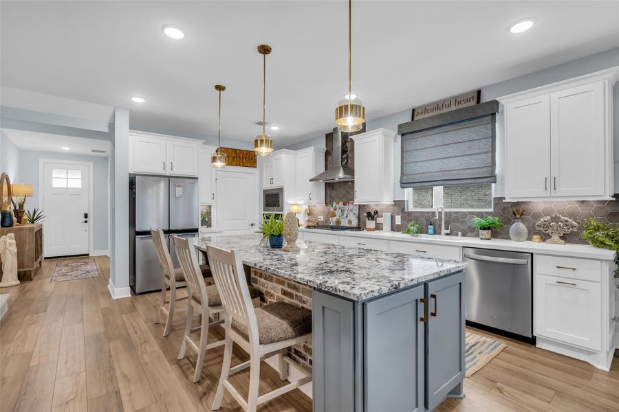 This light and bright home features an open concept living space with upscale finishes that delight the senses. This light and bright home features an open concept living space with upscale finishes that delight the senses.