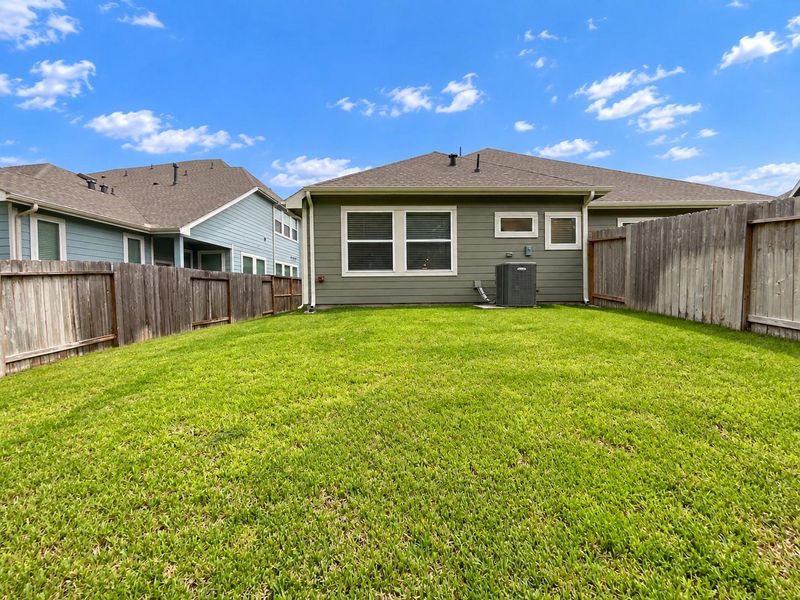 Exterior details and patio area of a home in Woodforest, Montgomery (Image 20).