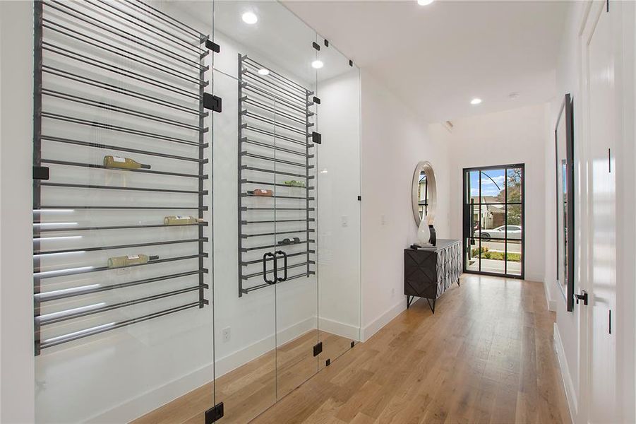 Wine cellar featuring light hardwood / wood-style flooring