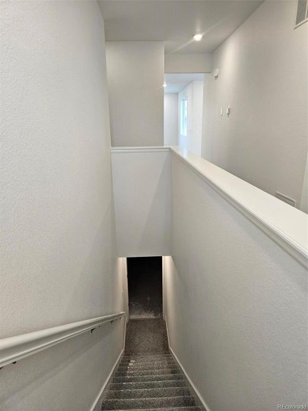 Spacious, unfurnished interior of a new home in The Cottages Collection at Ridgeline Vista, Brighton (Image 11).