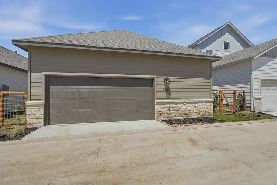 Front exterior of a new home in The Crossvine, Schertz, TX, highlighting curb appeal (Image 25).