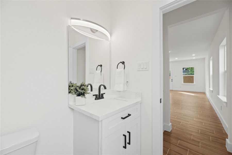 Conveniently located just off the living room, this half bathroom offers easy access for guests. Stylish and functional, it features modern finishes and a thoughtfully designed layout for comfort and convenience. Conveniently located just off the living room, this half bathroom offers easy access for guests. Stylish and functional, it features modern finishes and a thoughtfully designed layout for comfort and convenience.