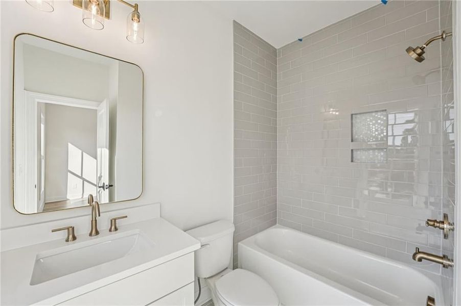 Bathroom featuring vanity and bathing tub / shower combination Bathroom featuring vanity and bathing tub / shower combination