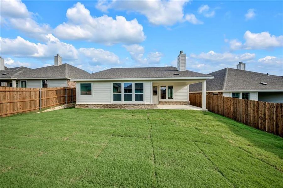 Front exterior of a new home in Liberty Pointe, Gainesville, TX, highlighting curb appeal (Image 1).
