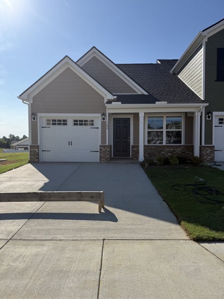 Front exterior of a new home in Legacy Fields, Pleasant View, TN, highlighting curb appeal (Image 1).