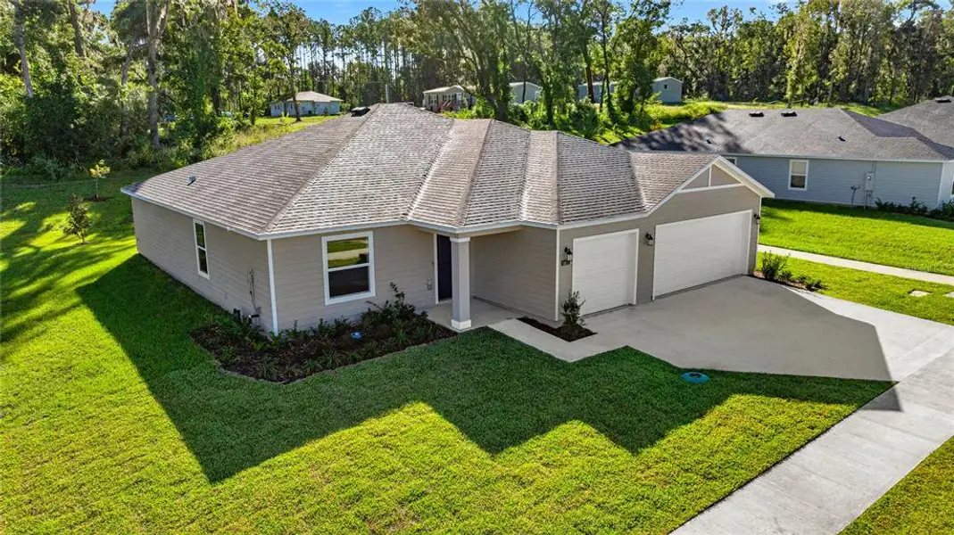 Front exterior of a new home in Marion Ranch, Ocala, FL, highlighting curb appeal (Image 5).