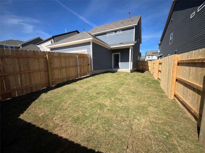 Exterior details and patio area of a home in Lariat, Liberty Hill (Image 22).