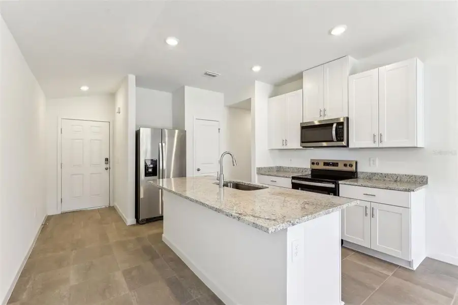 Furnished interior view inside a new home in Flagler Village - Classic Series, Palm Coast (Image 9).