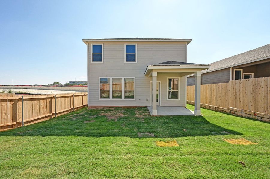Exterior details and patio area of a home in Creekside at Estancia, Austin (Image 2).