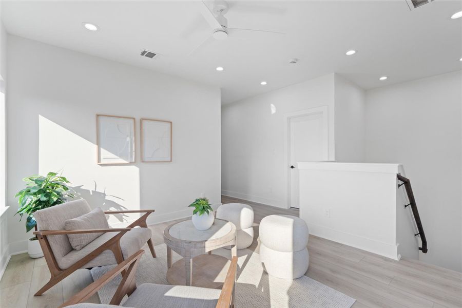 The secondary living area provides a thoughtful separation between the primary suite and secondary bedrooms, offering privacy while maintaining a connected, open feel. It’s an ideal space for family gatherings, homework, or a cozy retreat for quiet moments. This design balances functionality and comfort, making every part of the home feel intentional and livable. The secondary living area provides a thoughtful separation between the primary suite and secondary bedrooms, offering privacy while maintaining a connected, open feel. It’s an ideal space for family gatherings, homework, or a cozy retreat for quiet moments. This design balances functionality and comfort, making every part of the home feel intentional and livable.