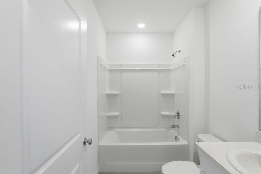 Furnished interior view inside a new home in Waterstone, Groveland (Image 28).