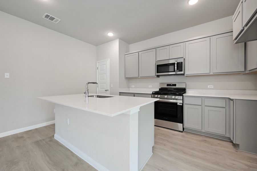 Kitchen in the Willow home plan by Trophy Signature Homes – REPRESENTATIVE PHOTO Kitchen in the Willow home plan by Trophy Signature Homes – REPRESENTATIVE PHOTO