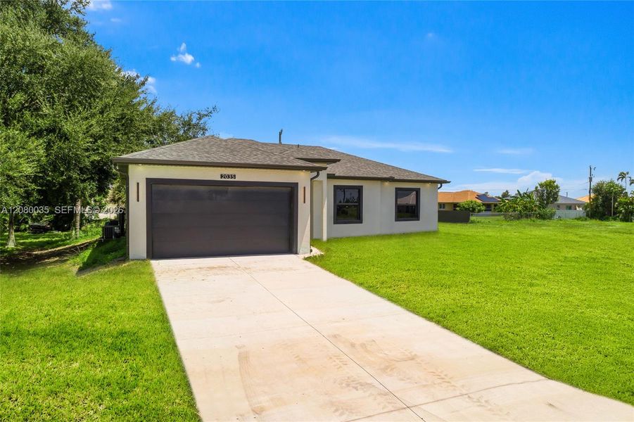 Front exterior of a new home in , Cape Coral, FL, highlighting curb appeal (Image 1). Front exterior of a new home in , Cape Coral, FL, highlighting curb appeal (Image 1).