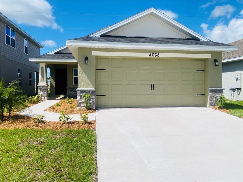 Front exterior of a new home in , St. Cloud, FL, highlighting curb appeal (Image 17).
