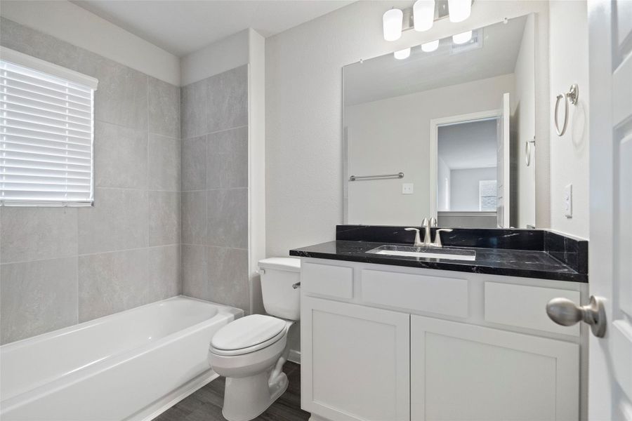 Furnished interior view inside a new home in Sunterra, Katy (Image 11).