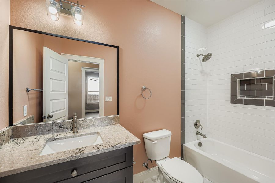 Bathroom featuring  shower combination and vanity