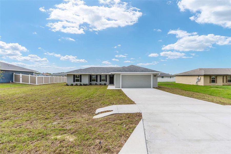 Front exterior of a new home in , Belleview, FL, highlighting curb appeal (Image 20).