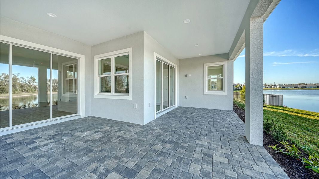 Exterior details and patio area of a home in Wildleaf, Parrish (Image 31).