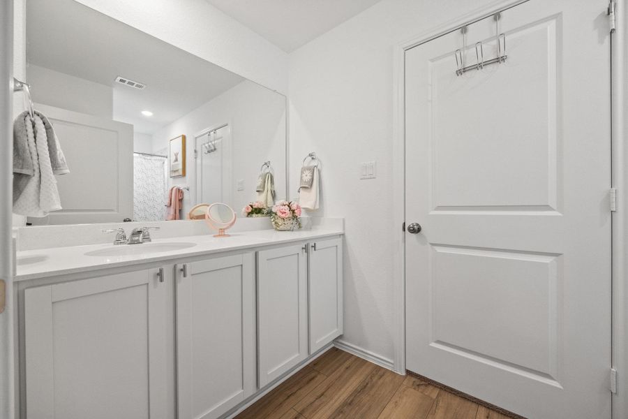 A well-appointed vanity, extensive counter space, and integrated storage offers everyday convenience. A well-appointed vanity, extensive counter space, and integrated storage offers everyday convenience.