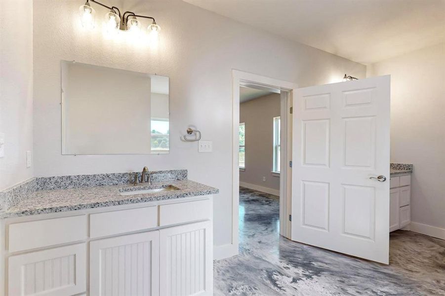 Bathroom featuring hardwood / wood-style floors and vanity