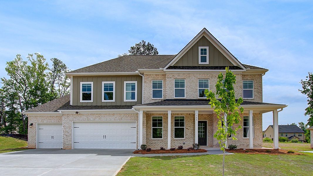 Representative exterior photo of a completed home built from the Stonefield by DRB Homes in Cambria at Traditions, Hampton, GA (Image 20).