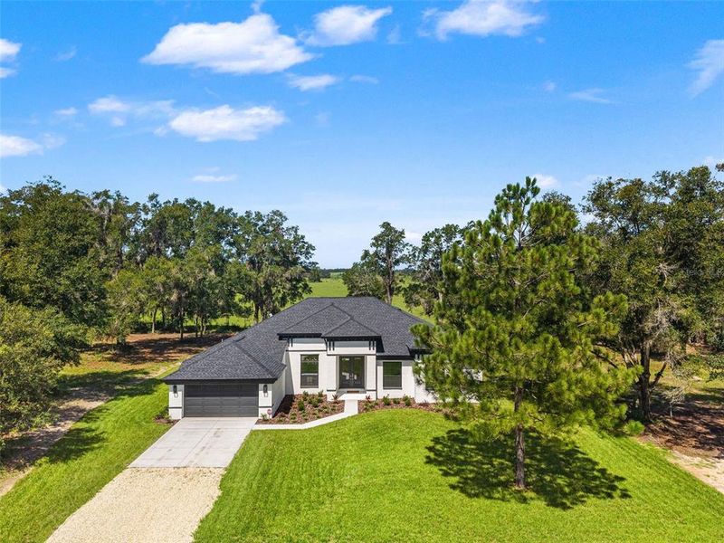 Front exterior of a new home in , Lecanto, FL, highlighting curb appeal (Image 25).