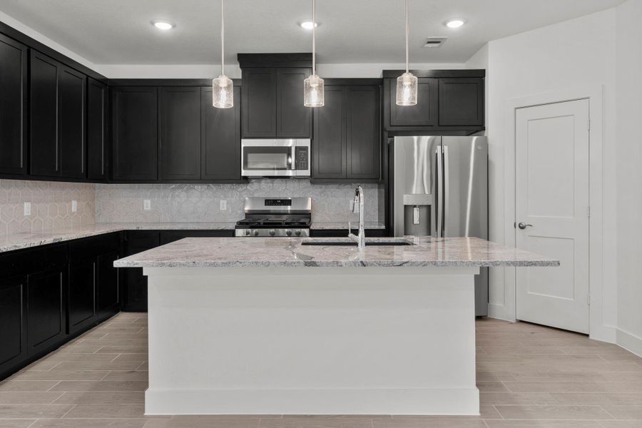 Furnished interior view inside a new home in Meridiana, Iowa Colony (Image 8).