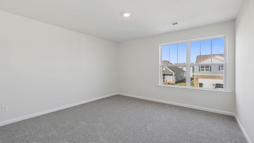 Spacious, unfurnished interior of a new home in Durbin Meadows Traditions, Fountain Inn (Image 24).