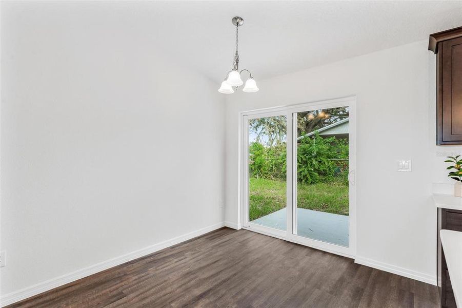 Dining Area with Sliding Doors leading to Backyard Area