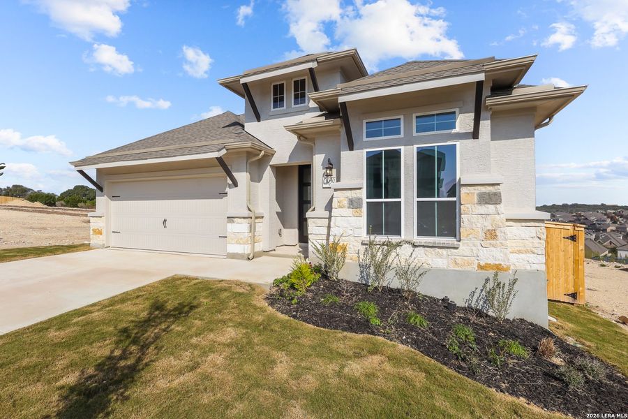 Front exterior of a new home in Ladera, San Antonio, TX, highlighting curb appeal (Image 20).