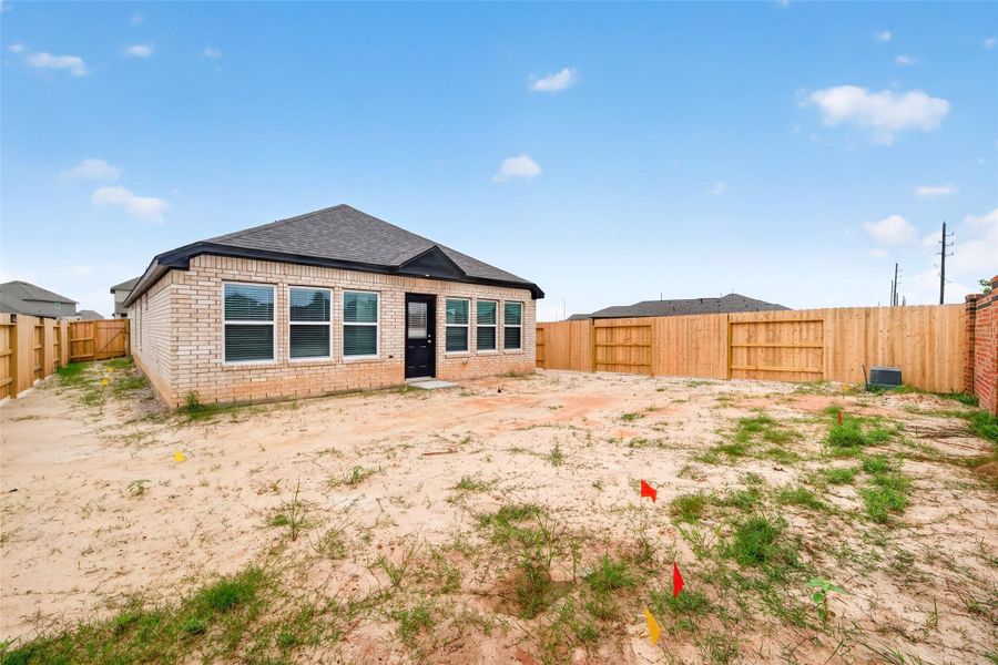Exterior details and patio area of a home in Sunterra, Katy (Image 28).