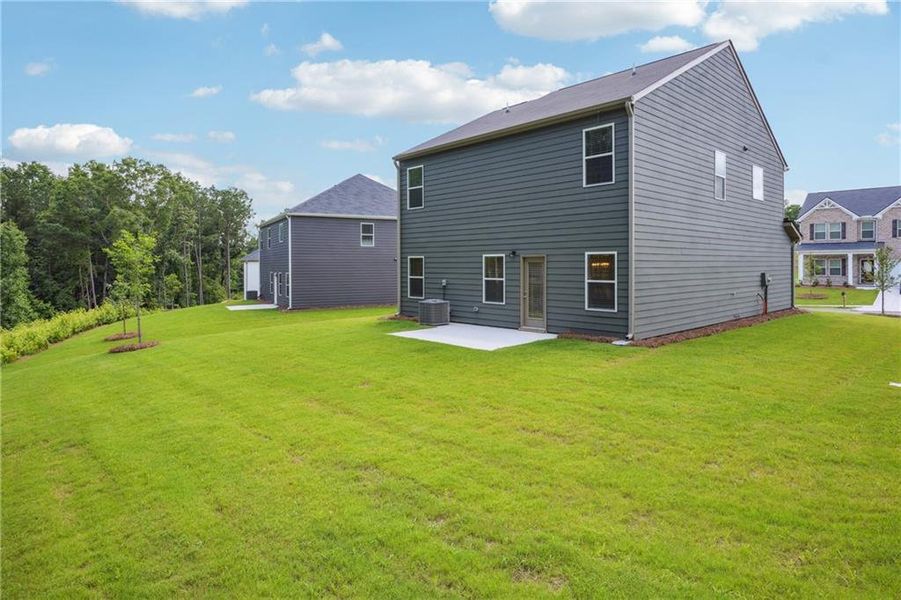 Front exterior of a new home in River Walk Farm, Covington, GA, highlighting curb appeal (Image 2).