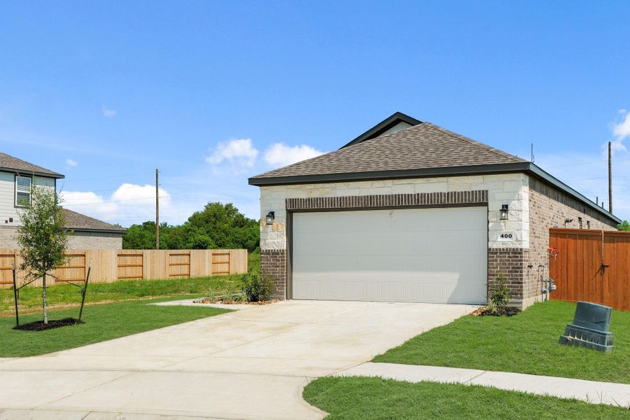 Front exterior of a new home in River Ranch Trails, Dayton, TX, highlighting curb appeal (Image 17).