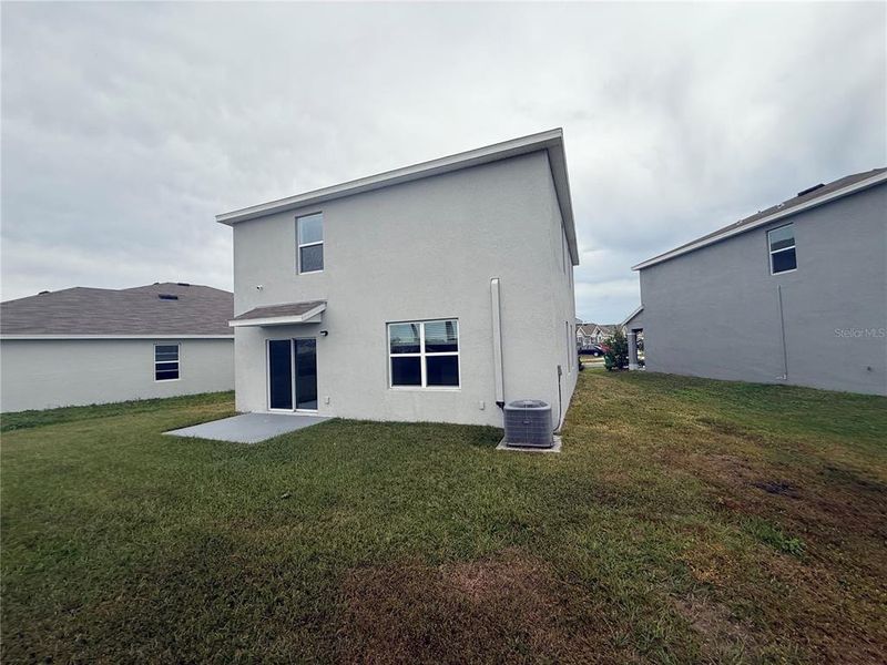 Exterior details and patio area of a home in Westgate at Avalon Park, Wesley Chapel (Image 3).