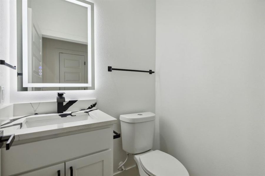 Bathroom featuring toilet and vanity