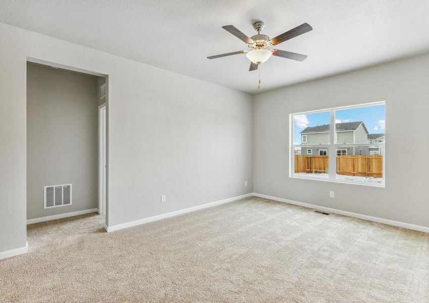 The family room has large windows that let in natural light.