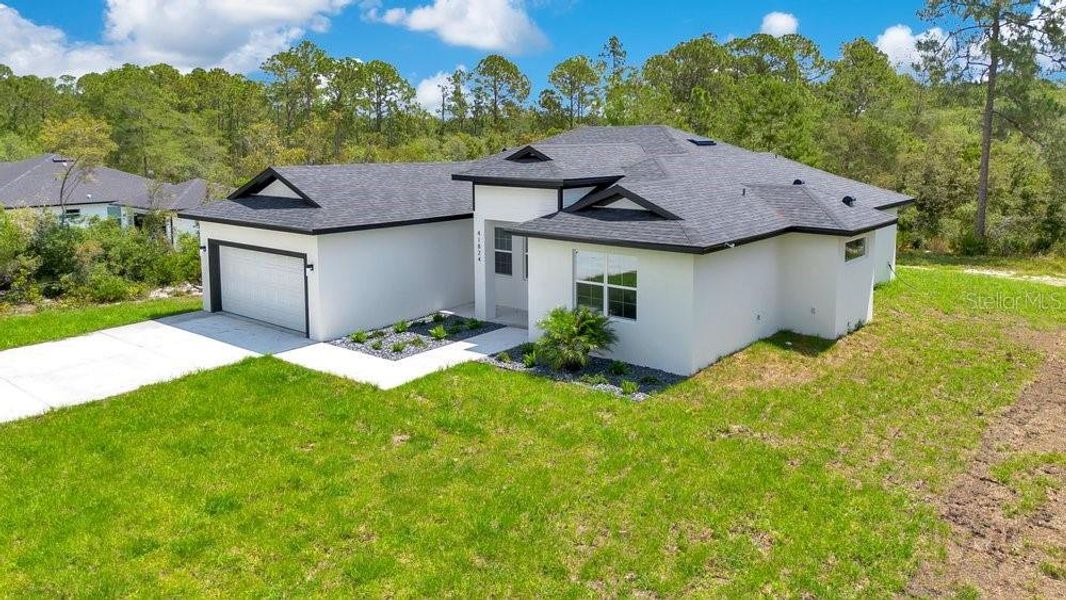 Front exterior of a new home in , Eustis, FL, highlighting curb appeal (Image 22).