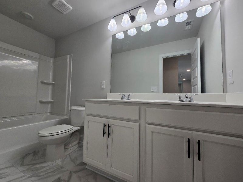 Furnished interior view inside a new home in Waters Edge, Mansfield (Image 6).