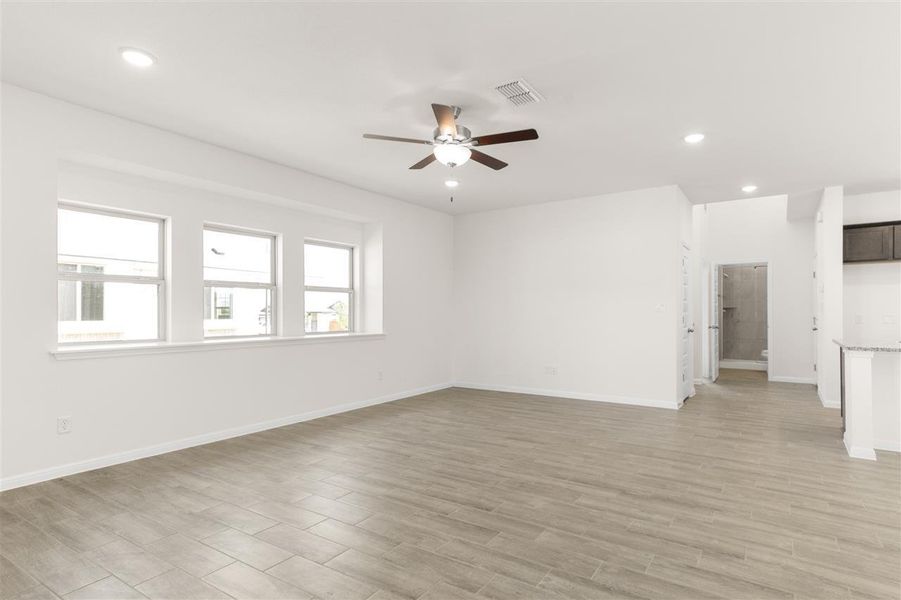 Unfurnished room with visible vents, recessed lighting, light wood finished floors, and ceiling fan