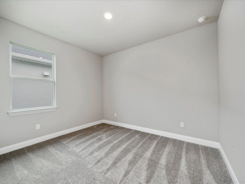 Bedroom in the Onyx floorplan at 6383 NW Sweetwood Drive in Brystol at Wylder